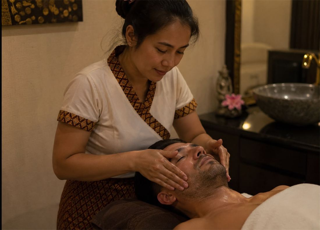 Facial treatment being performed at home in Thailand