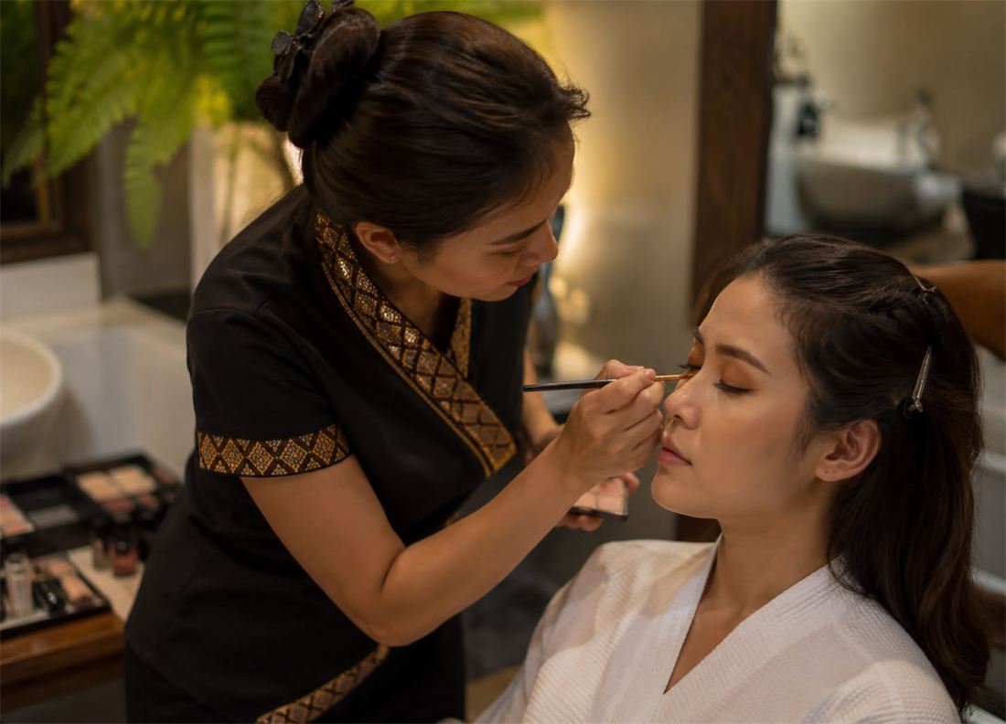 Makeup artist applying makeup at a hotel in Thailand